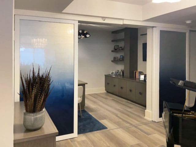 White opaque doors in a living room opened showing living space.